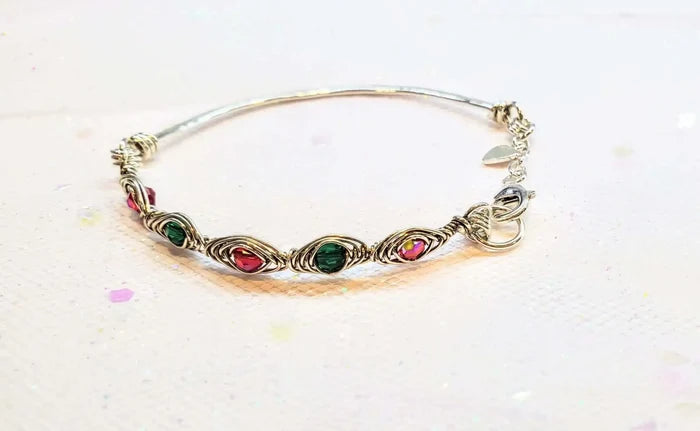 Limited Edition Red Green Christmas Holiday Tube Bracelet showcasing ruby red and emerald green Swarovski crystals in wirework.