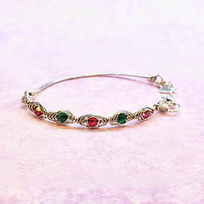 Limited Edition Red Green Christmas Holiday Tube Bracelet showcasing ruby red and emerald green Swarovski crystals.