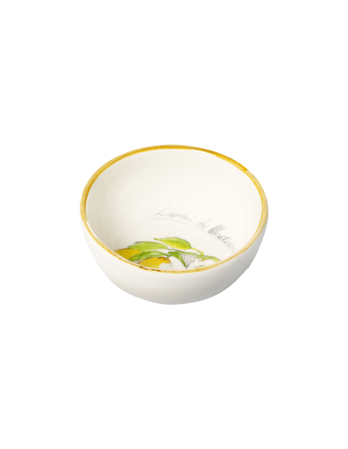 White bowl with gold rim and green leaf design