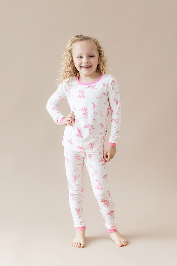 Young girl posing wearing the Long Sleeve Pajamas in Toile Ballet