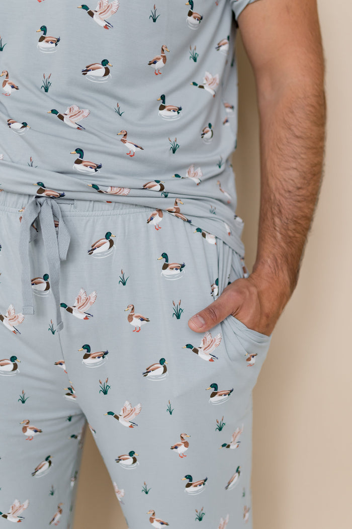 Close up of the drawstring waist and pocket on the Men's Lounge Pants in Mallard Duck shown on a male model