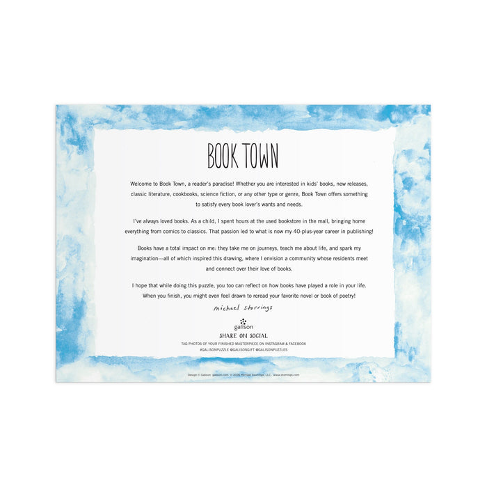 A decorative letter with a blue watercolor border and “Book Town” title welcomes readers to a book lover’s haven—like entering the world of the Michael Storrings Book Town 1000 Piece Puzzle by Michael Storrings, full of joy and literary inspiration.