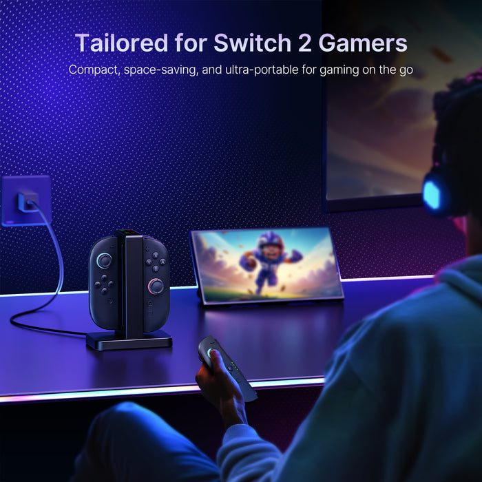 A man plays Switch 2, with an enhanced charging dock beside him.