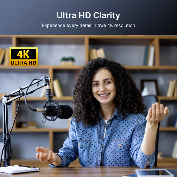 A woman is live streaming using a 4K webcam.