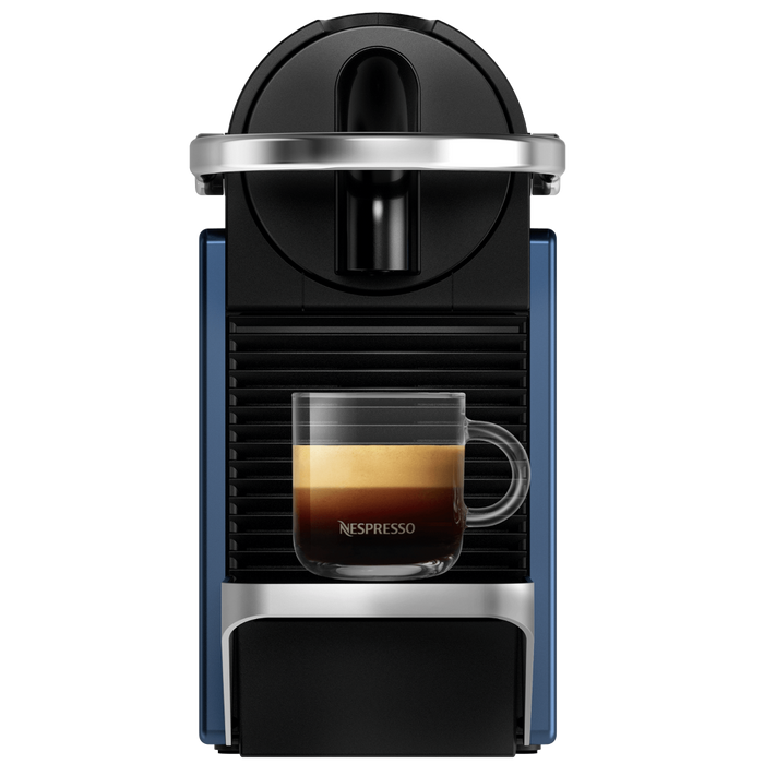 Nespresso coffee machine with a glass of coffee on a white background