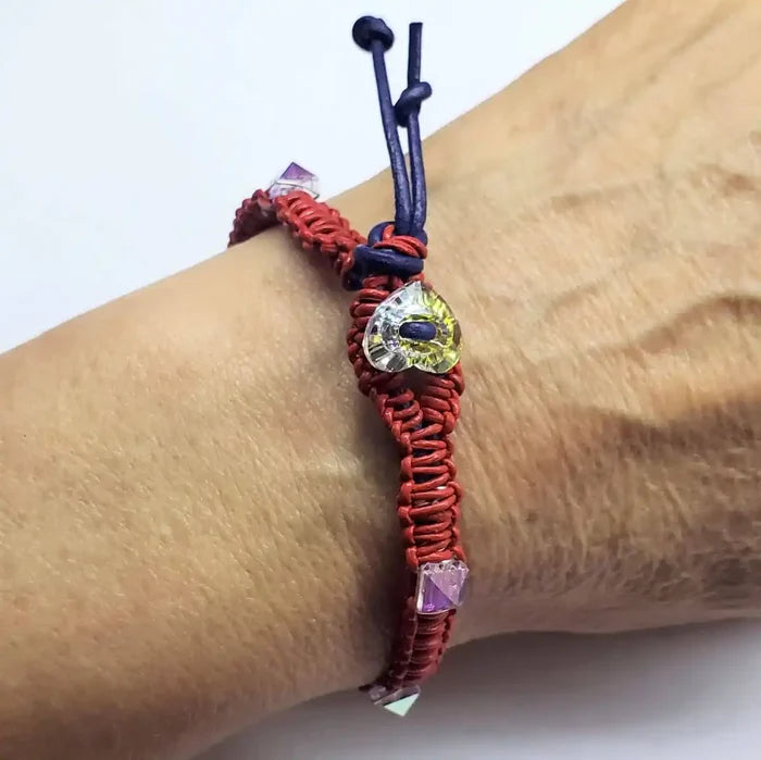 Red White and Blue Macrame Wire Wrap Crystal Spike Bracelet on wrist showcasing intricate design and crystal accents.