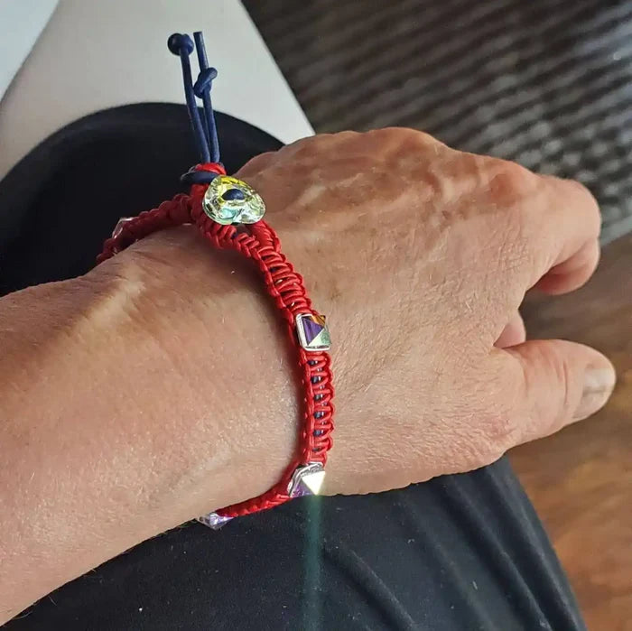 Red White and Blue Macrame Wire Wrap Crystal Spike Bracelet worn on a hand, showcasing its unique design and texture.