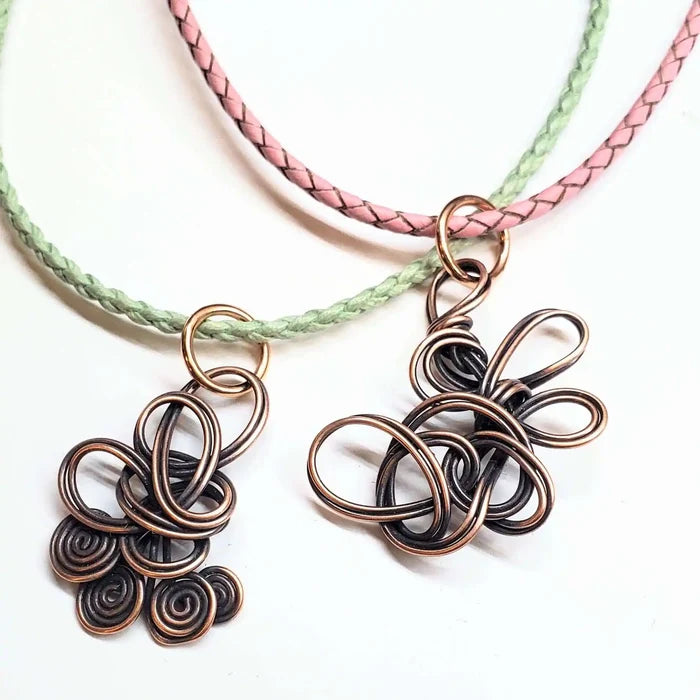 Reversible Interchangeable Copper Wire Sculpted Necklaces showcasing unique handmade designs on colorful cords.