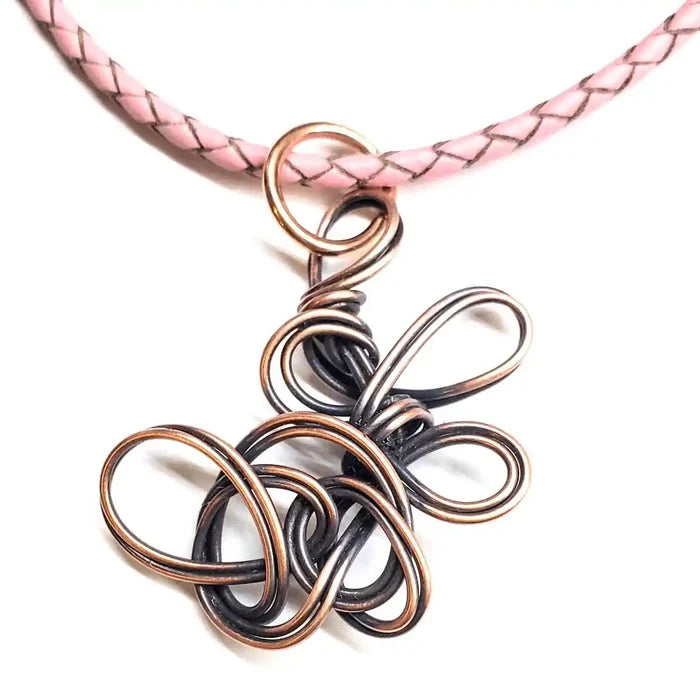 Reversible Interchangeable Copper Wire Sculpted Necklaces featuring an artfully crafted design on a pink braided cord.