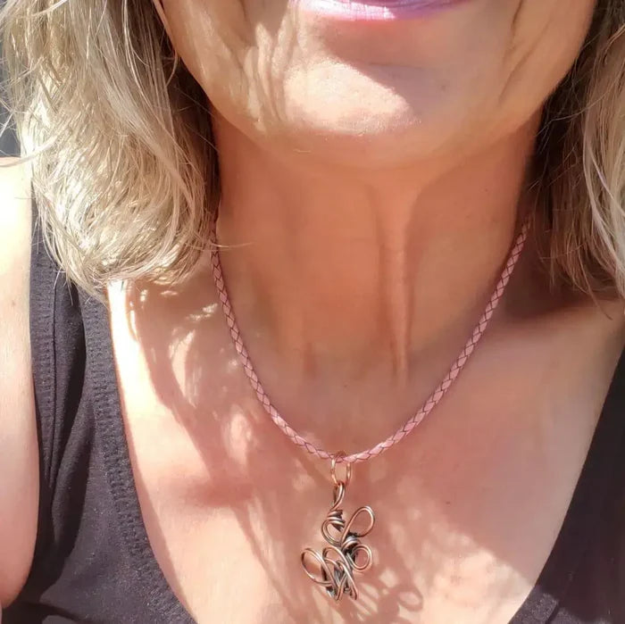 Reversible Interchangeable Copper Wire Sculpted Necklaces worn by a woman, showcasing handmade art and unique design.