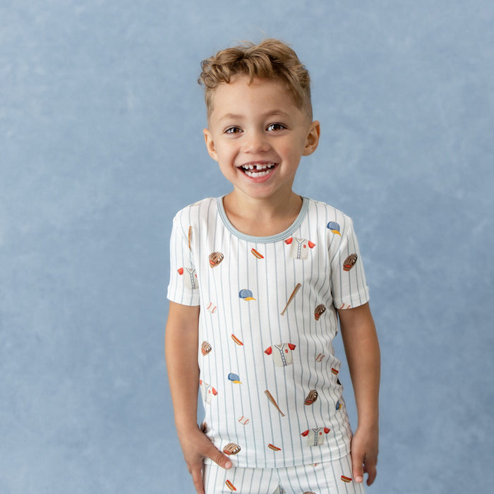 Smiling boy wearing the Short Sleeve Pajamas in Home Run