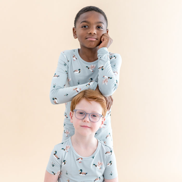 Two boys modeling the Short and Long Sleeve Pajamas in Mallard Duck