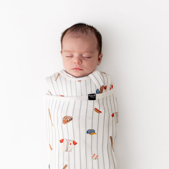 Close up of sleeping newborn swaddled in the the Sleep Bag Swaddler in Home Run 1.0