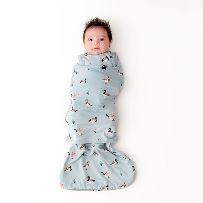 Newborn swaddled in the Sleep Bag Swaddler in Mallard Duck 0.5