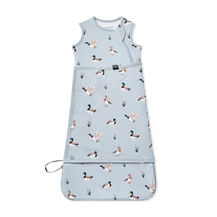 Sleep Bag Swaddler in Mallard Duck 0.5 shown swaddled on a white surface
