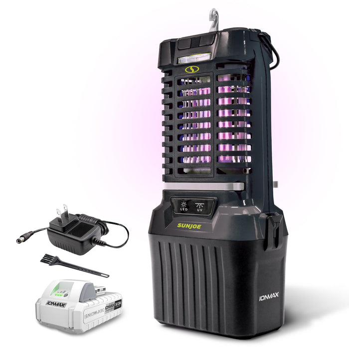 Black Ionmax UV bug zapper with purple light glow, shown with a black charger, black cleaning brush, and white battery pack on a white background.