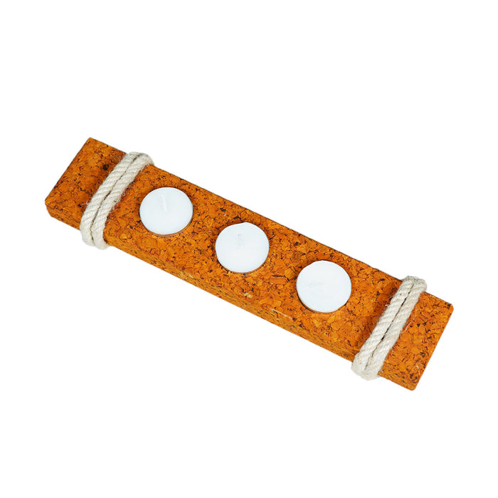 Cork board with three holes and a rope handle on a white background
