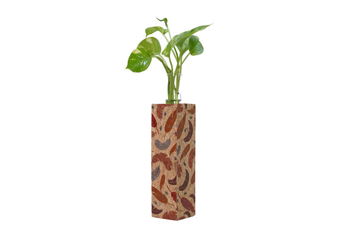 Decorative vase with a plant on a white background