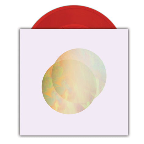 A transparent red vinyl by TALLHART partially slides out of a white album cover with two overlapping iridescent circles. This limited edition includes a free download card.