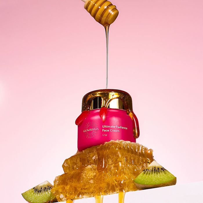 Pink face cream jar with honey drizzle and kiwi slices on a pink background