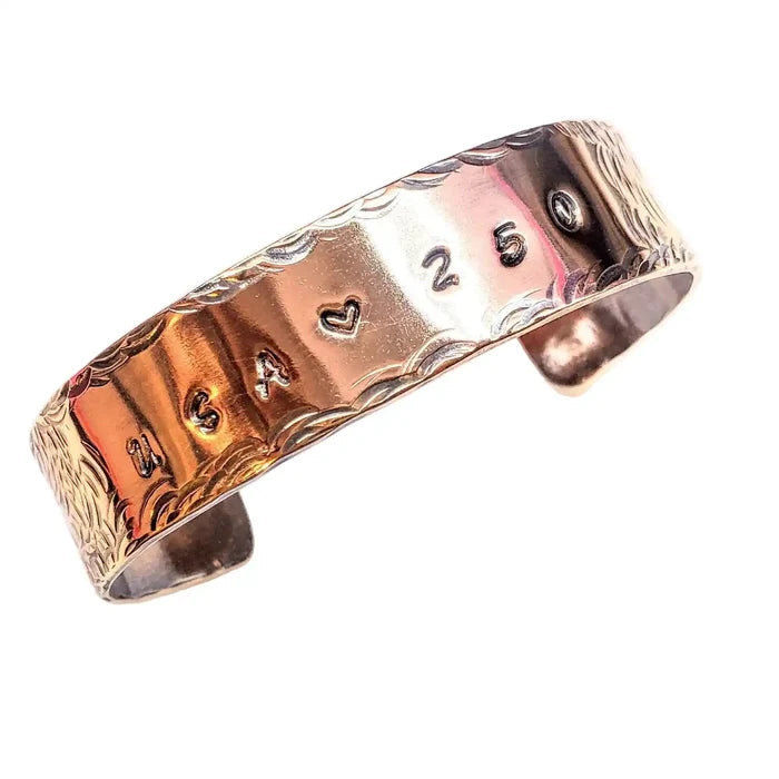 Copper bracelet with engraved with USA 250 on a white background
