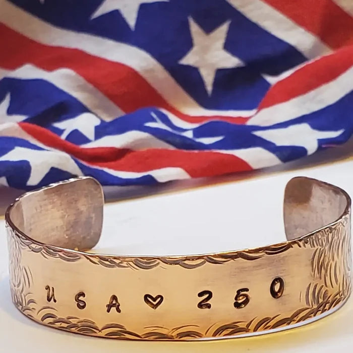 Wide Copper Cuff with 'USA 250' engraving on a background of the American flag.