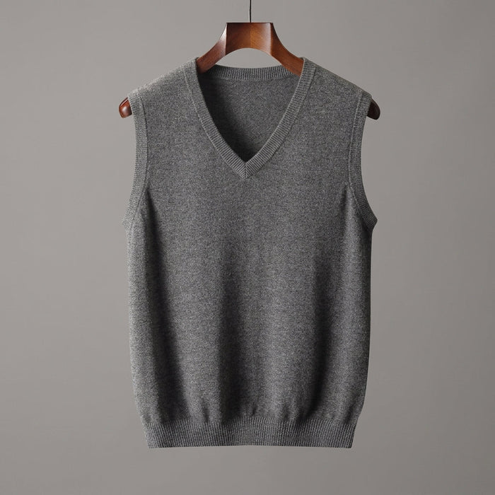Front view of a V-neck knit sweater vest styled over a shirt