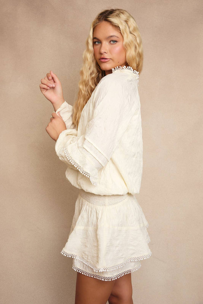 V-NECK WAIST SMOCKED AND RUFFLE DETAIL ROMPER: IVORY