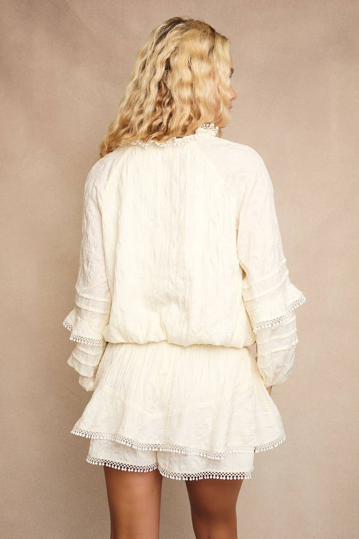 V-NECK WAIST SMOCKED AND RUFFLE DETAIL ROMPER: IVORY