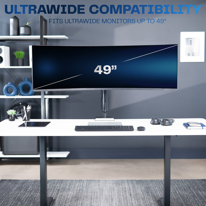 Ultrawide monitor on a desk in a modern office setup.