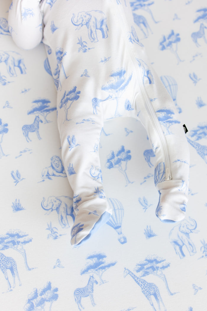 Close up of the zipper closure and enclosed feet on the Zippered Footie in Toile Safari