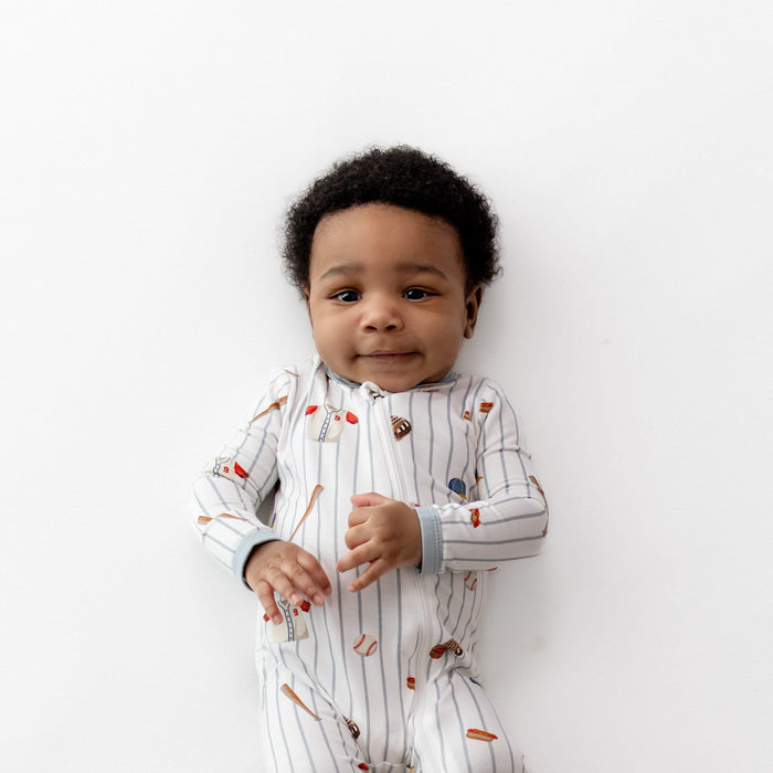 Close up of the Zippered Romper in Home Run shown on an infant