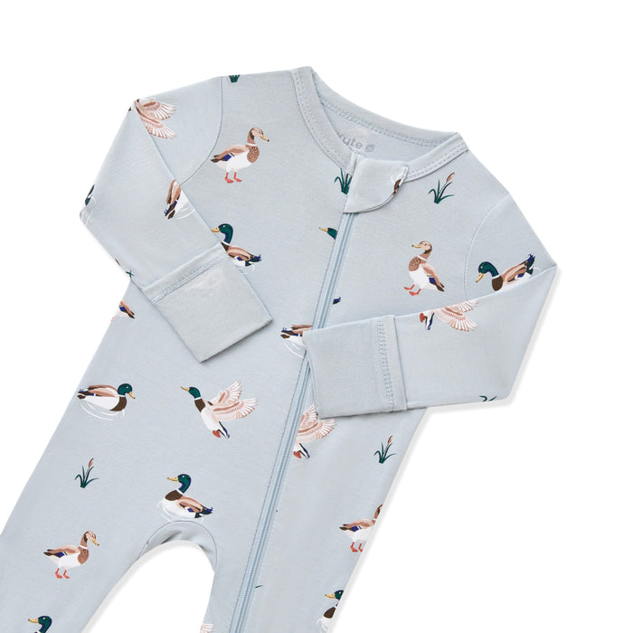 Close up of the zipper garage and fold over hand cuffs on the Zippered Romper in Mallard Duck